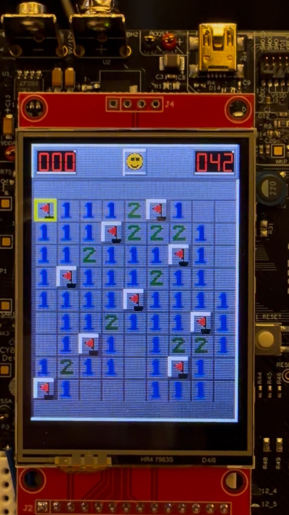 The completed board updates the flags, timer, and face together.